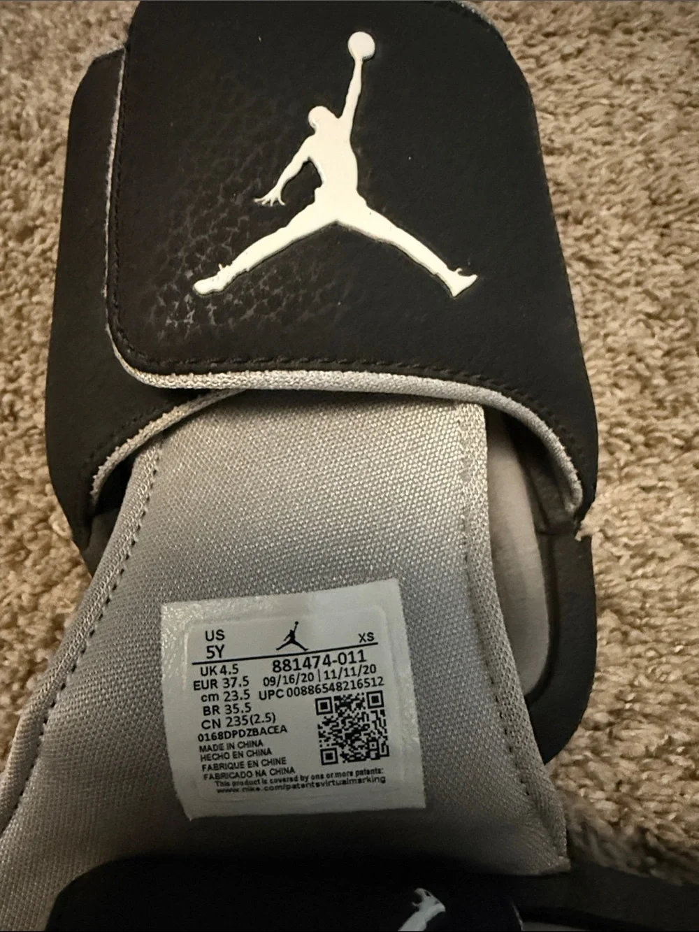 Jordan Kids Black and Gray Slide Sandals with Jumpman Logo